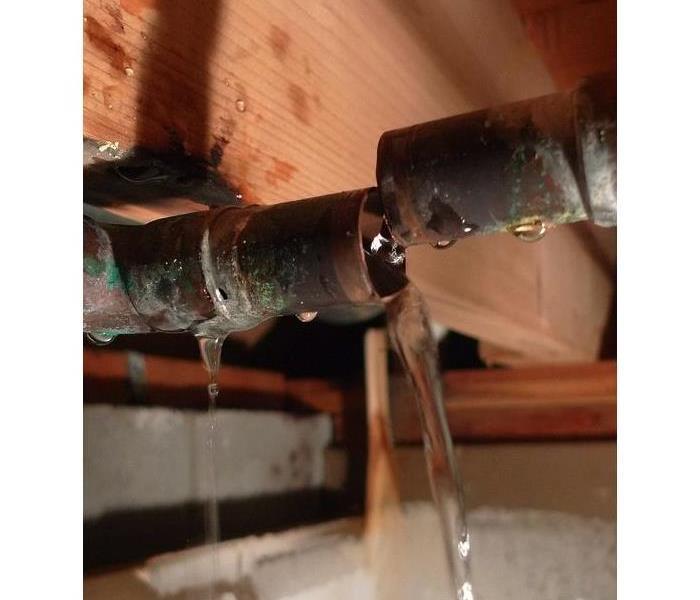 Copper broken water pipe with leaking water
